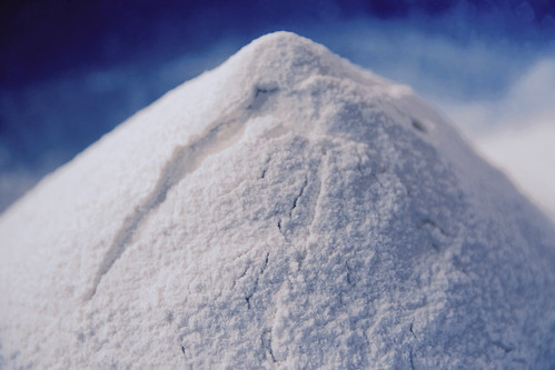 close-up photo of a 'mountain' of white flour against a blue background