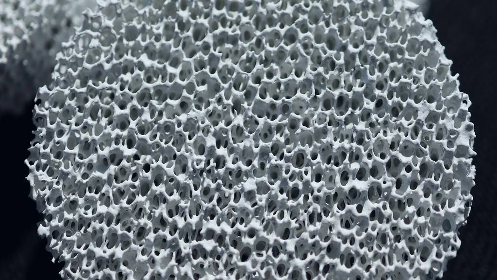 A close up macro shot of a white ceramic coated sponge created by nano technology research and development to be new type of desiccant. Credit AREE / Adobe Stock
