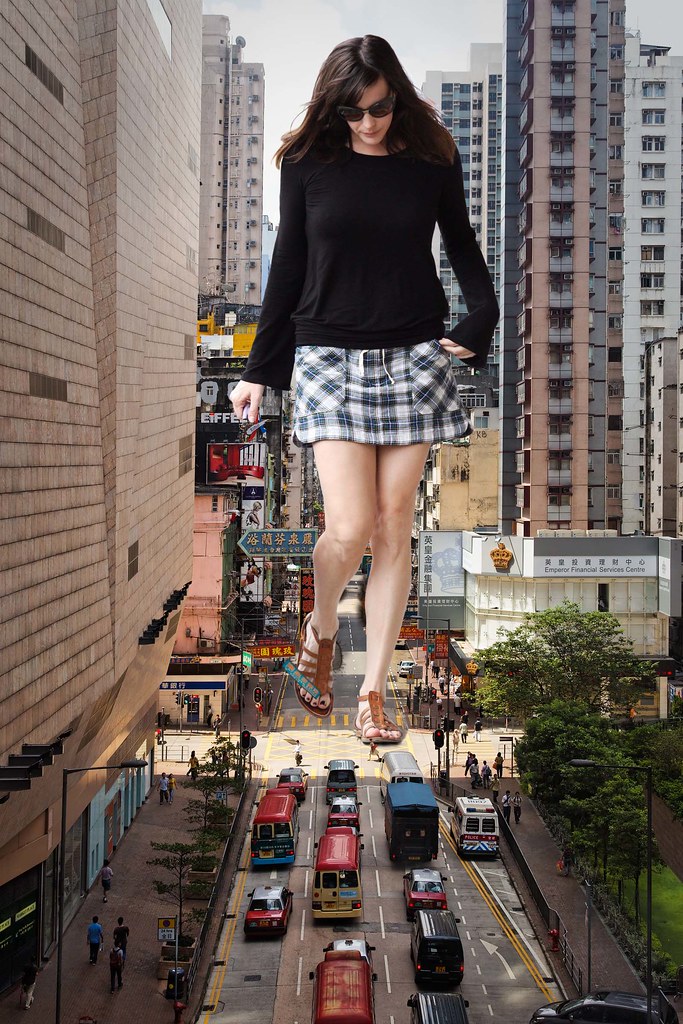 Mini giantess walking around building advert pictures