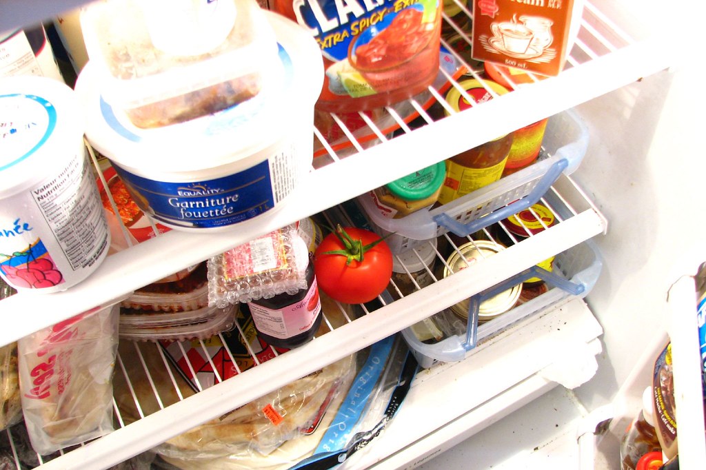 Food in the Fridge. There are some tomatoes in the fridge