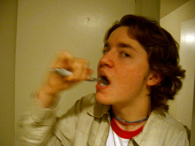 Garrett brushes his teeth