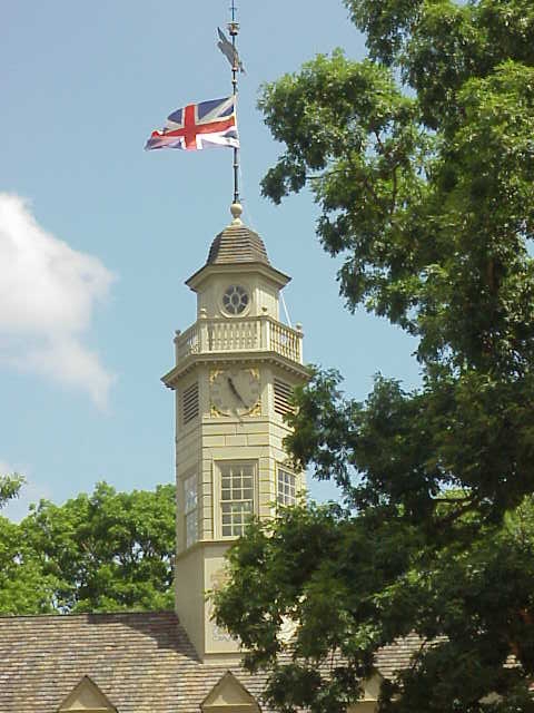 Colonial Clocktower Building The Capitol's Clocktower Flies the Flag of Colonial Founding Nation - a ...