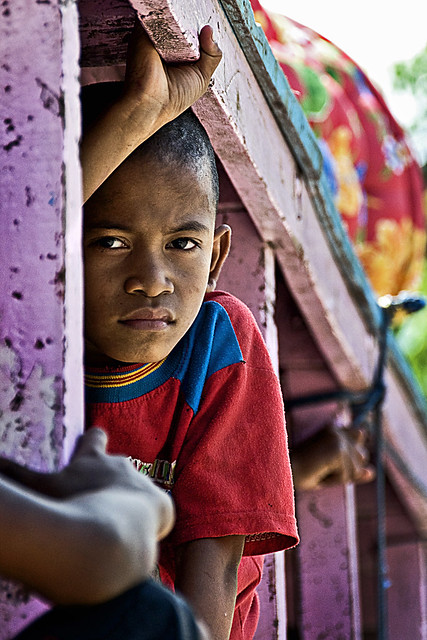 Maumere, Flores - A Maumere boy in an over crowded truck