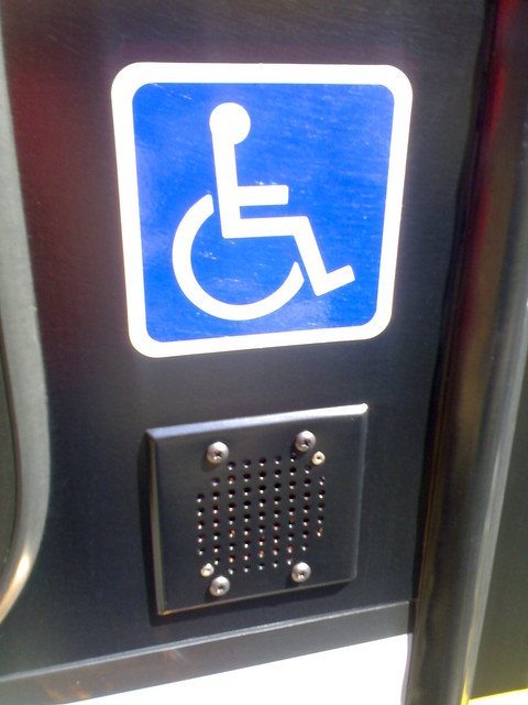 Accessible Sign and Speaker Outside a Nova Bus