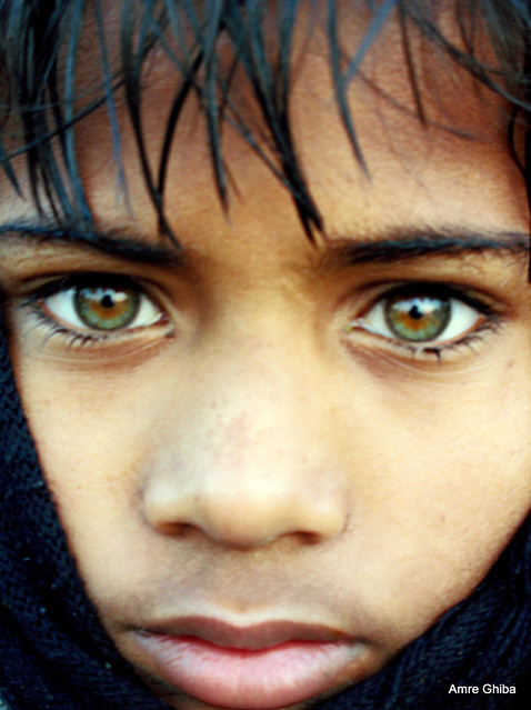 Green-eyed indian boy during Ardh Kumbh Mela |The most beautiful eyes | My National Geographic cover portrait | Somehow related to Mc Curry's Afghan Girl with beautiful green eyes ?