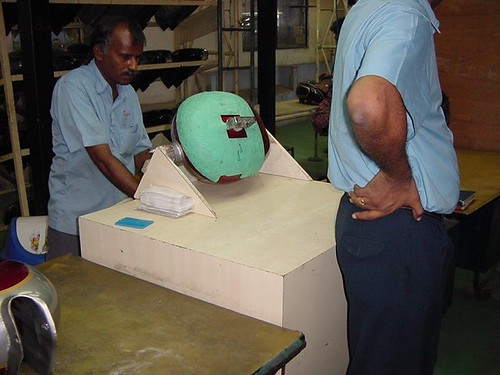 Petrol tanks being masked for painting | by Royal Enfield