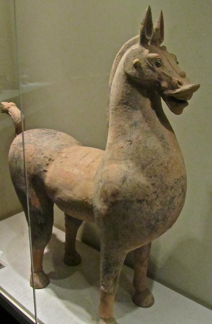Standing horse with embossed faces