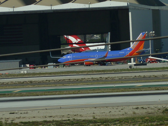 Southwest Airlines jet and grounded Quantas A380 jet at LAX Airport in Los Angeles, California