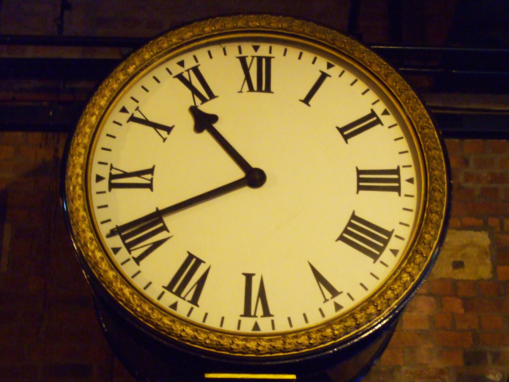 Large round clock with Roman numerals
