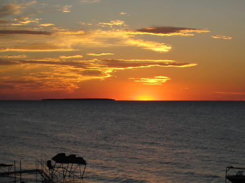 Sunset Over Lake Huron by david_s_carter, The sun sets over Lake Huron, near Caseville. Charity Island is in the distance.sunset lakehuron