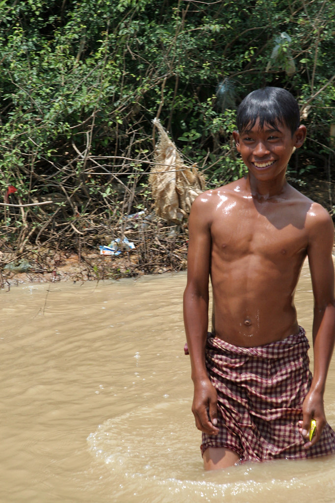 Cambodian Fishing Boy in River, CONFUSER