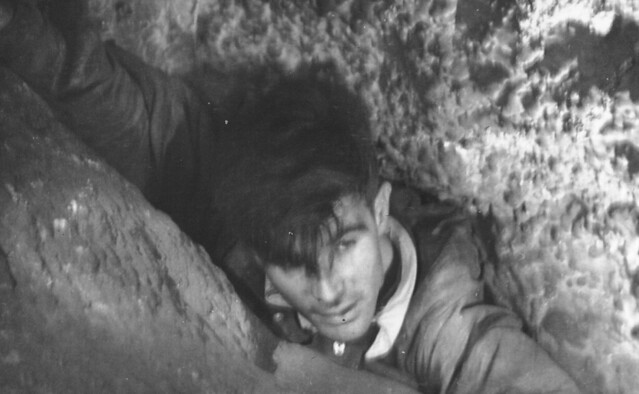 Graeme J in Timor Cave rock pile and flattener or squeeze.