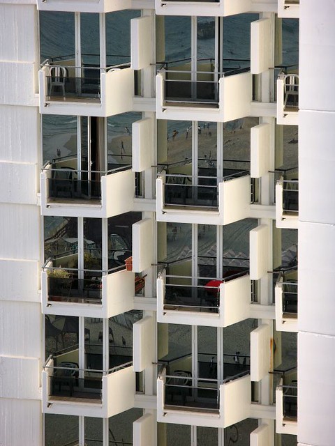 Tel Aviv beach reflected in hotel windows