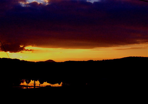 sunset red orange brown sun mountain black clouds pond kentucky southeasternkentucky pinevilleky sr25e