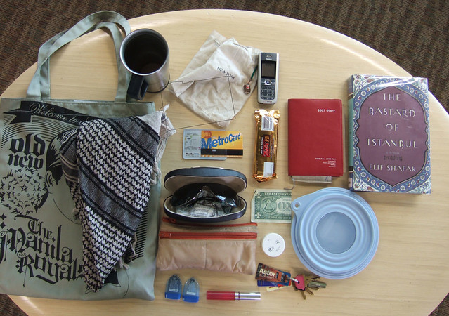 The items Cia carries when she doesn't have an 8-pound pork shoulder in her tote bag