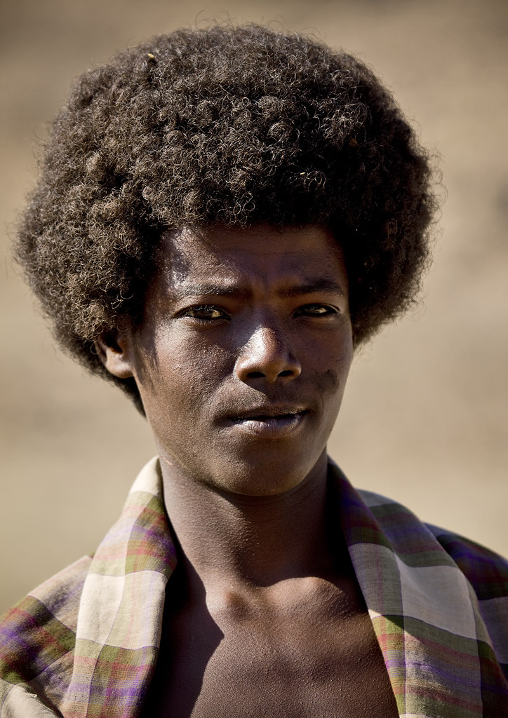 Afar young man with traditional haircut, Danakil, Ethiopia.