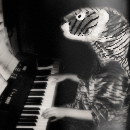 The Child Experiments with Being a Tiger Playing Piano by Juli Kearns (Idyllopus)