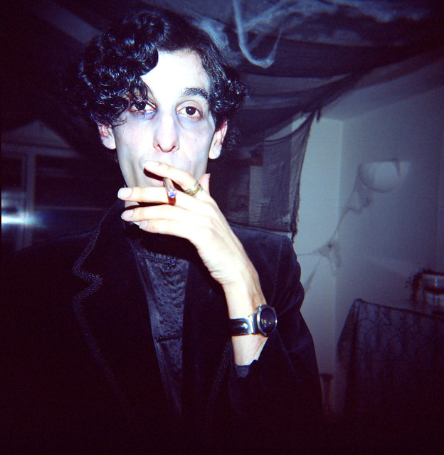 Close-up of guy at Halloween party with electric cig