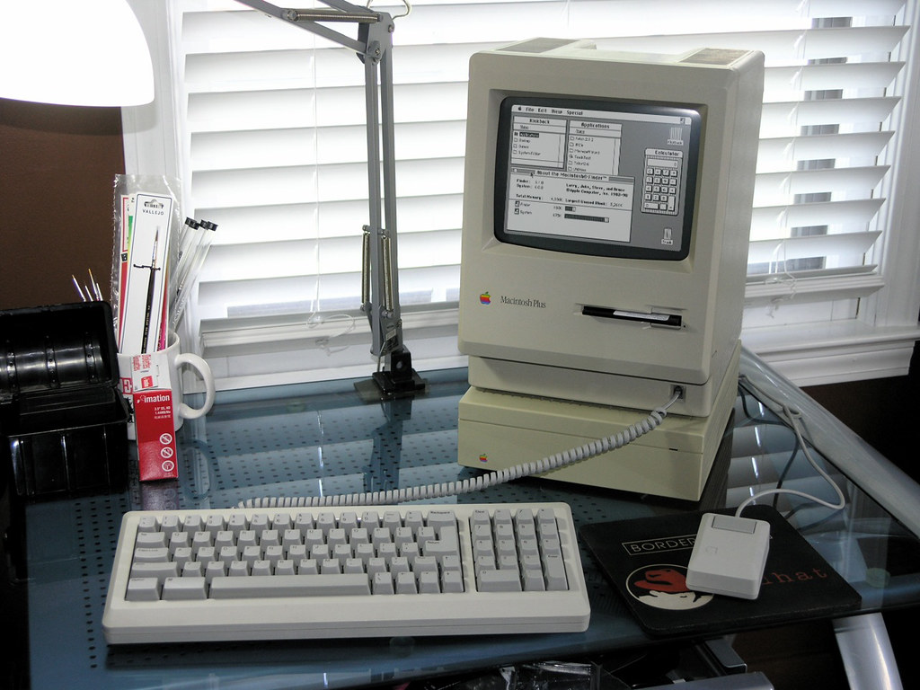 Macintosh Plus with HD20 SC external SCSI hard drive, keyboard, and mouse running System 6.0.8.