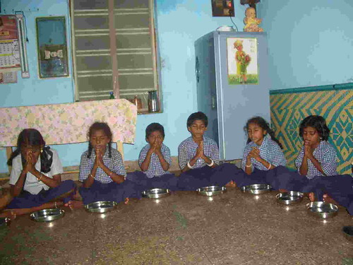 Children learn how to pray at meal times | by St Adrians Reachout Centre