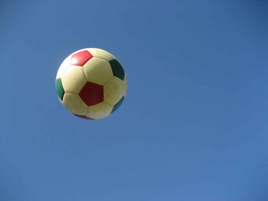 gucci soccer ball in flight, laying on a hammock throwing i…