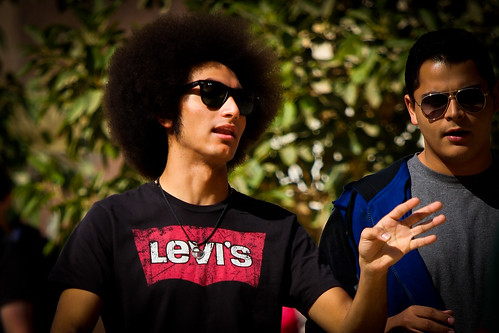 street trees light portrait sun sunlight 3 man male guy green face sunglasses shirt canon hair walking landscape photography glasses is necklace big interesting ray dof hand bokeh african background afro north sunny stranger cairo telephoto adobe egyptian sideburns lit usm gesture creeper talking ban levis auc 70200 chin harsh cleft lightroom wayfarers americanuniversityincairo f4l 550d cairene t2i