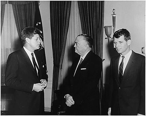 Public Domain: President John F. Kennedy with Robert F. Kennedy and J. Edgar Hoover by Abbie Rowe (NARA)