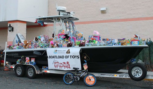 Photo of boat on a trailer covered with donated toys