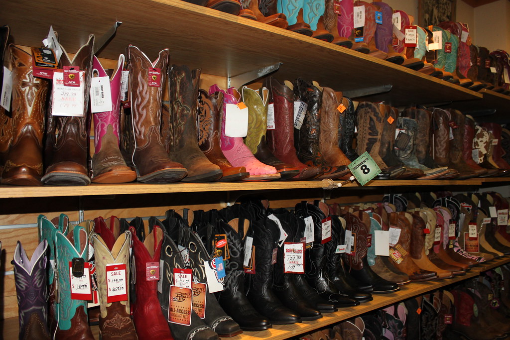 Look at all them cowboy boots for sale at The Wrangler in … | Flickr