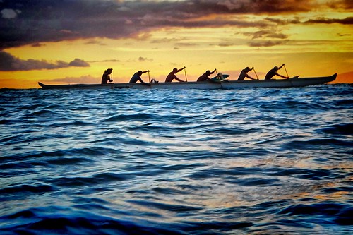 Six man canoe with Maui Sunset taken from in the water by Don Briggs