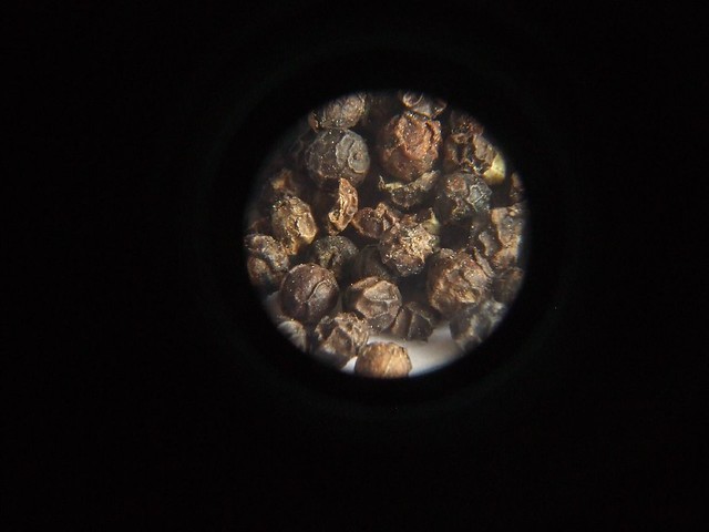 Macro (close up) photo of peppercorn through a telephoto lens that belongs to a Pentax KM SLR camera
