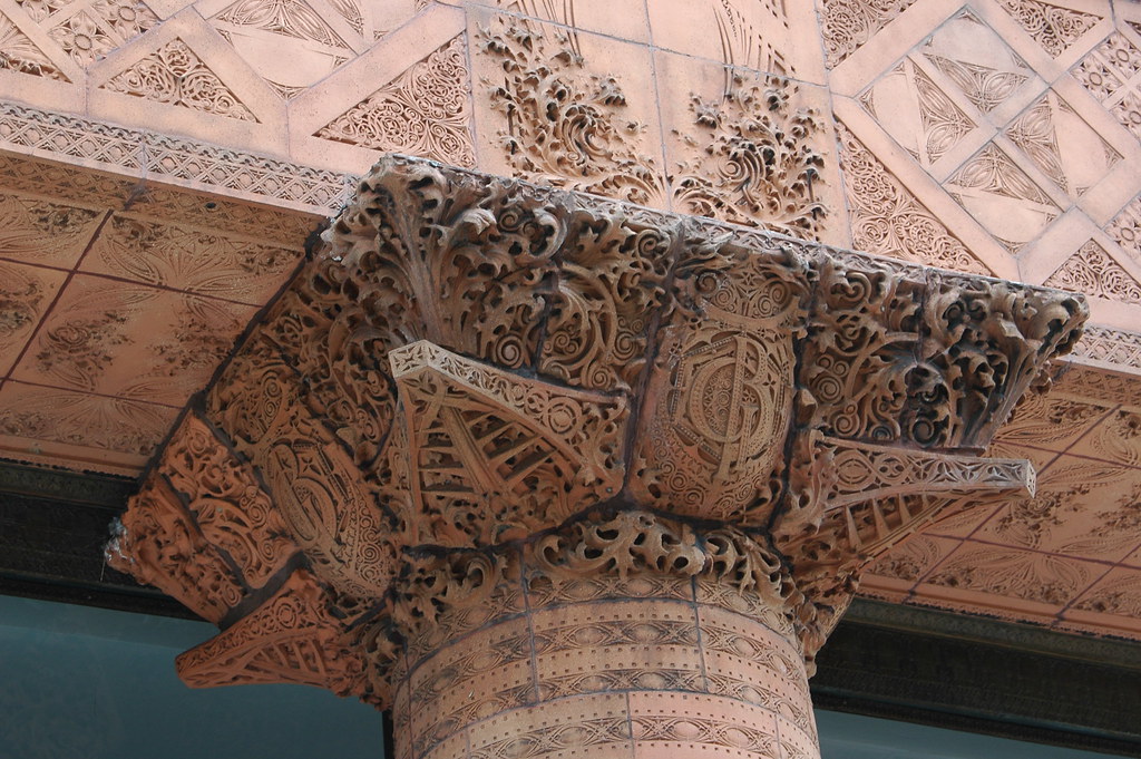 From the Prudential Guaranty Building, the top of a column with ornate, engraved designs. 