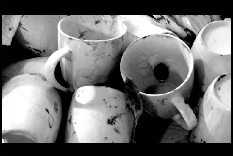 The dirty cups (prop) photoshopped to black and white.