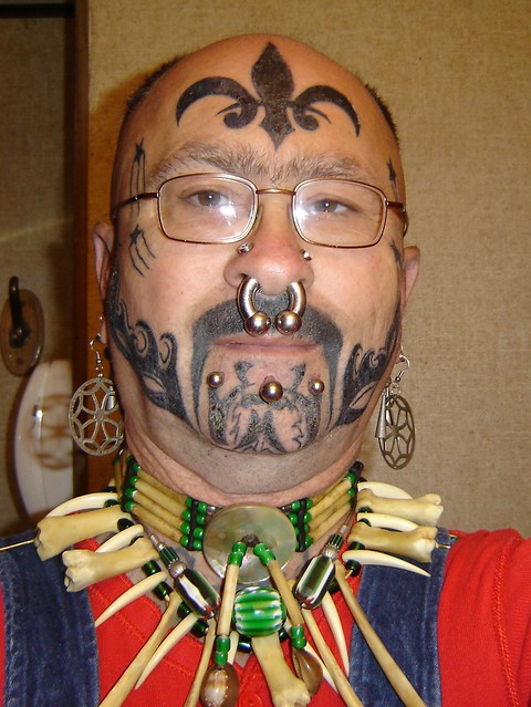 my face tattoos and peircings and bones