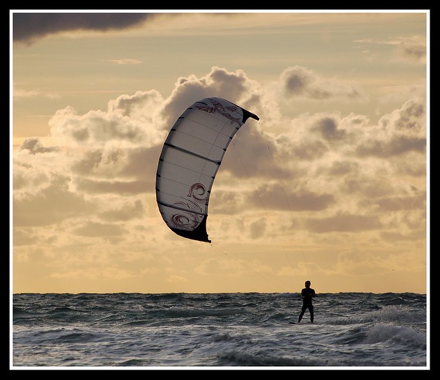 Kite surfer at sunset