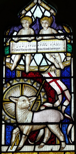 Agnus dei with angels above.