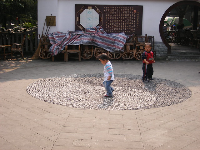 Yin Yang symbol and children at play