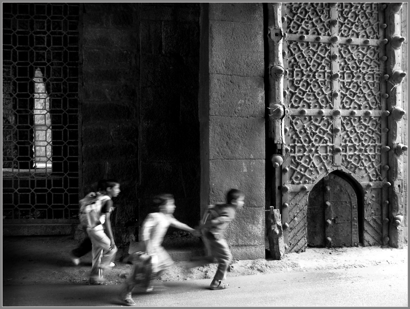 Running through the Gate of Golkonda Fort, Hyderabad by Sukanto Debnath