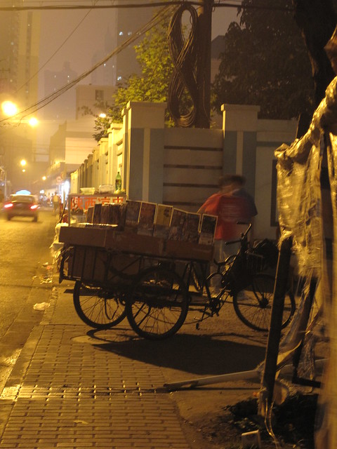 local DVD Store on wheels (with another hawker selling cold food next to it)