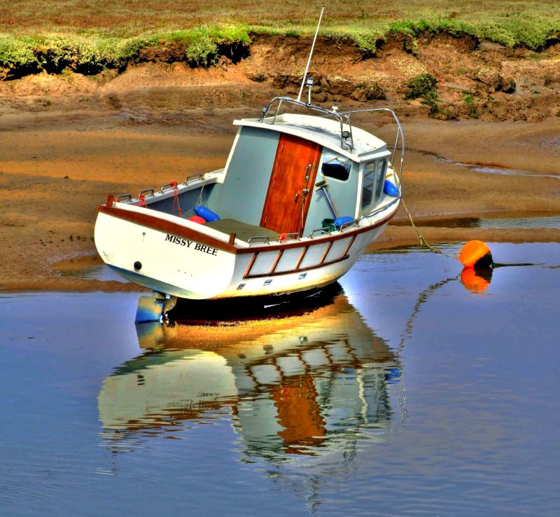 Boat reflection. by tina negus