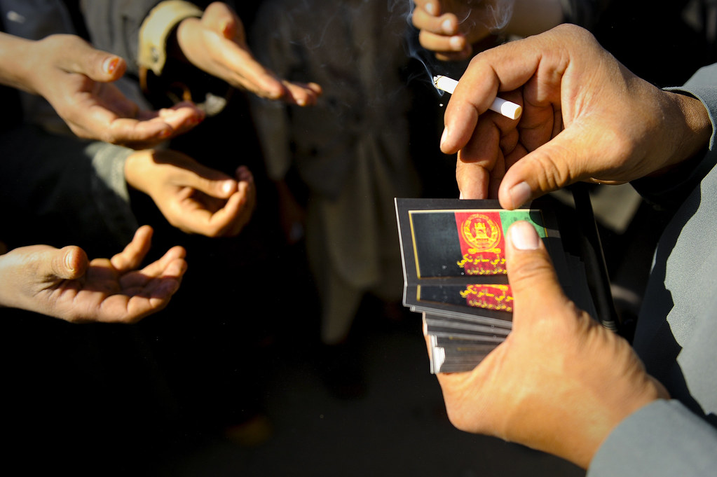 101115-F-3682S-215 | An Afghan National Police officer hands… | Flickr