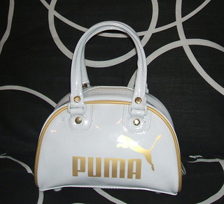 white and gold puma bag