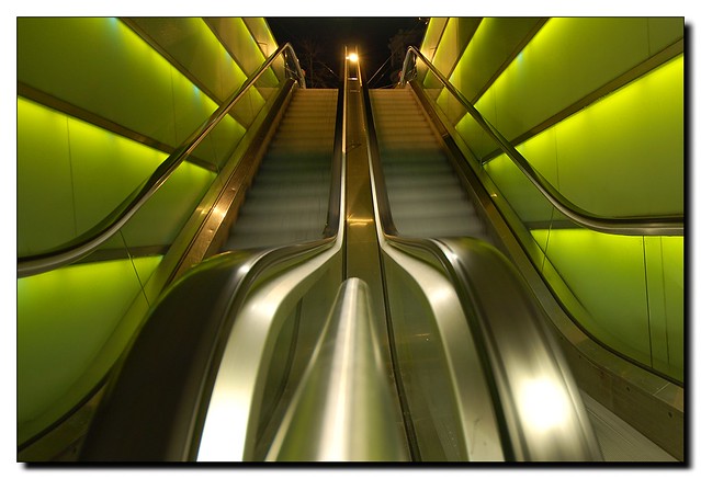 green illuminated escalators