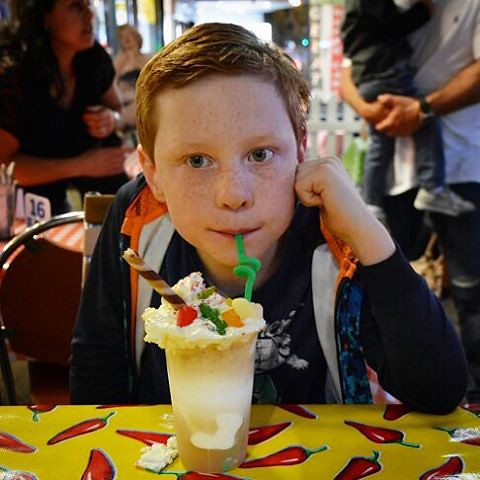 Mr10 rockin the icecream soda @missamericasdiner.  Topped with whipped cream studed with lollies what kid wouldnt be impressed.  He made the comment to me as we left that he thought the service was amazing. #icecreamsoda #soda #creamingsoda #milkshake #ri