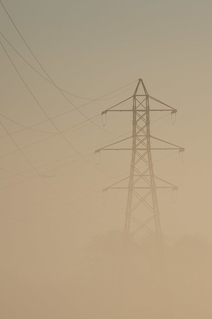 Pylon in golden morning mist