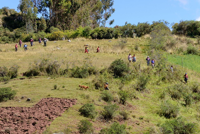 Farmers working in fields at Carved rock at Inca ruins at Killarumiyoq in Peru-27 5-27-15