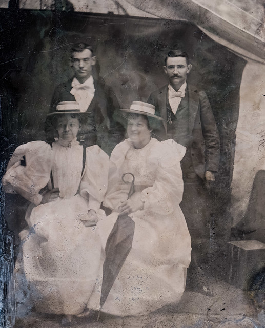 Two couples standing ahead of a tent (tintype, USA)