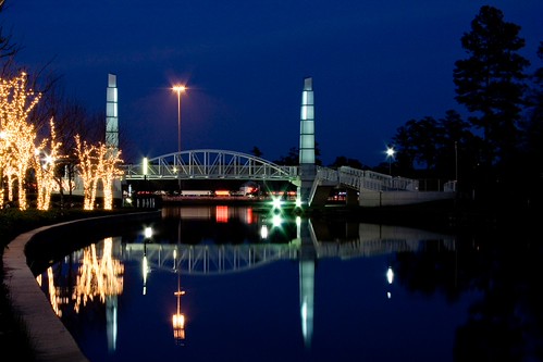 Spires by zkywords, The Woodlands Waterway at sunset, looking east towards the bridge connecting the south side to the <