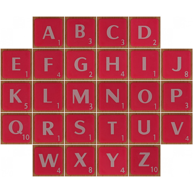 Scrabble white letter on hot pink alphabet