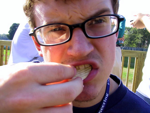 Grant eating a potato chip